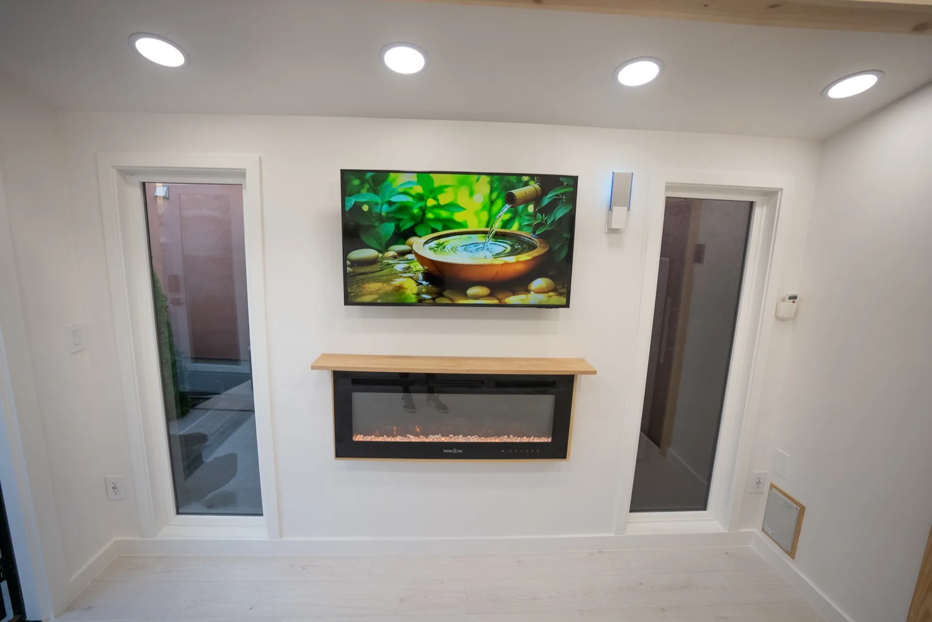 Entertainment wall with TV and electric fireplace